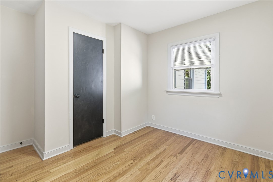 8456 Atlee Road Mechanicsville, VA 23116 - Photo 17 of 28 an empty room with wooden floor and windows