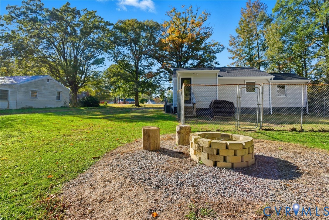 8456 Atlee Road Mechanicsville, VA 23116 - Photo 25 of 28 a view of a house with backyard and a tree