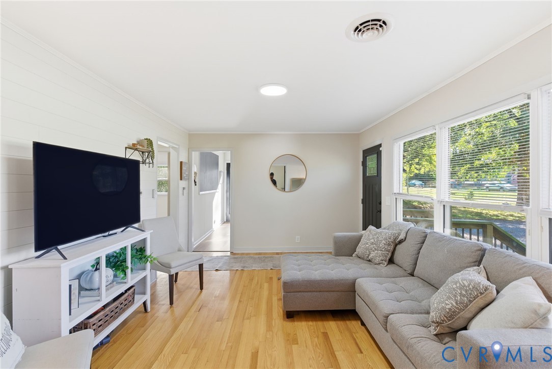 8456 Atlee Road Mechanicsville, VA 23116 - Photo 3 of 28 a living room with furniture and a flat screen tv