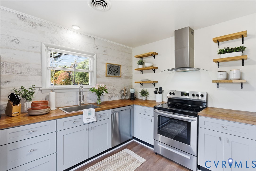 8456 Atlee Road Mechanicsville, VA 23116 - Photo 8 of 28 a kitchen with a sink stove and cabinets