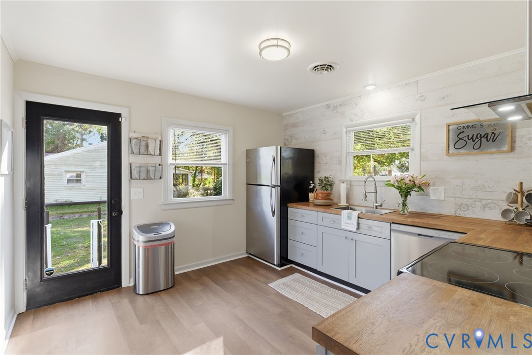 8456 Atlee Road Mechanicsville, VA 23116 - Photo 9 of 28 a kitchen with a sink and refrigerator