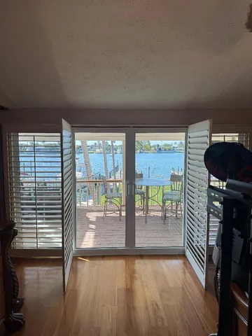 a city view from a balcony with chairs