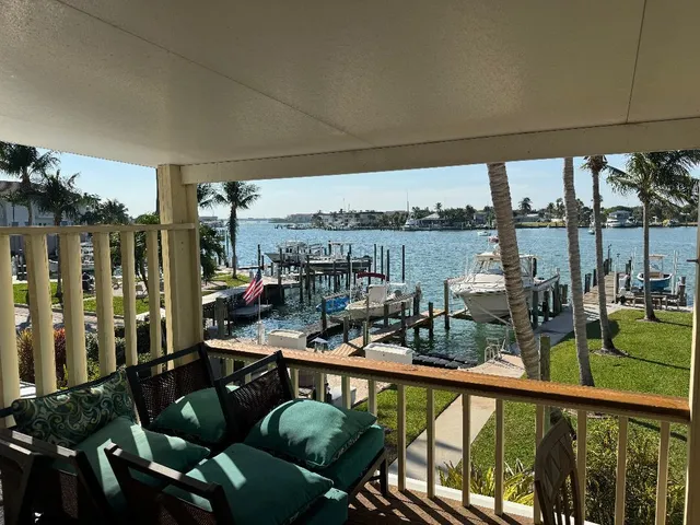 a view of a chairs and table in balcony