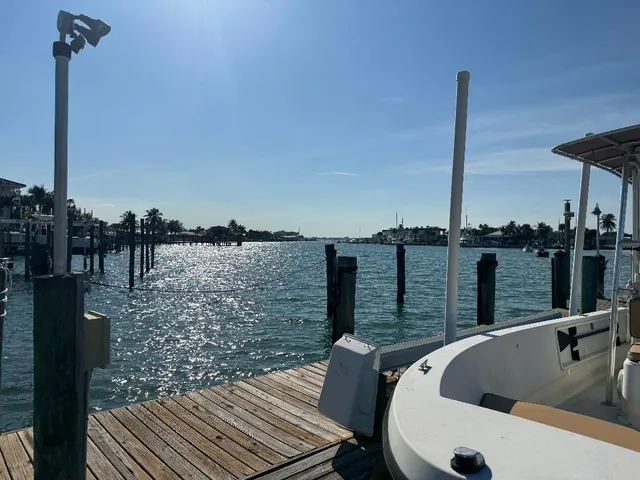 a view of roof deck with a table and chairs