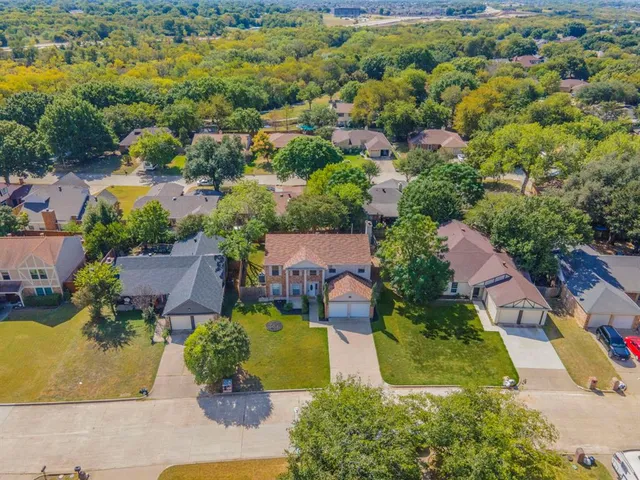an aerial view of a house with yard swimming pool and outdoor seating