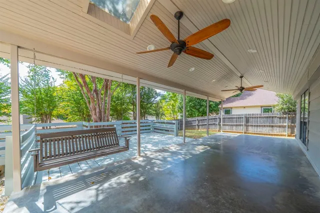 a view of a deck with a yard