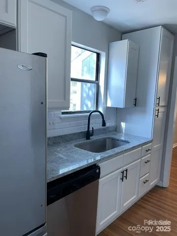 a kitchen with a stove and a microwave