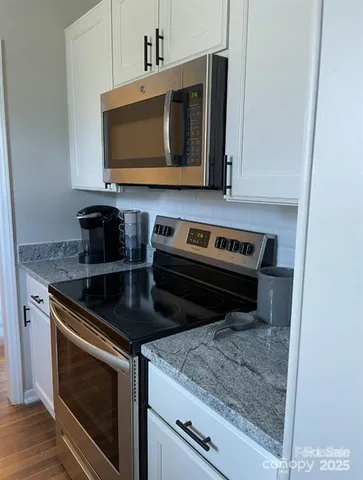 a bathroom with a double vanity sink and mirror