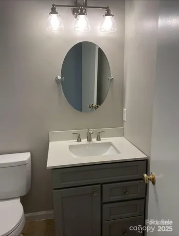 a bedroom with a bed and a chair