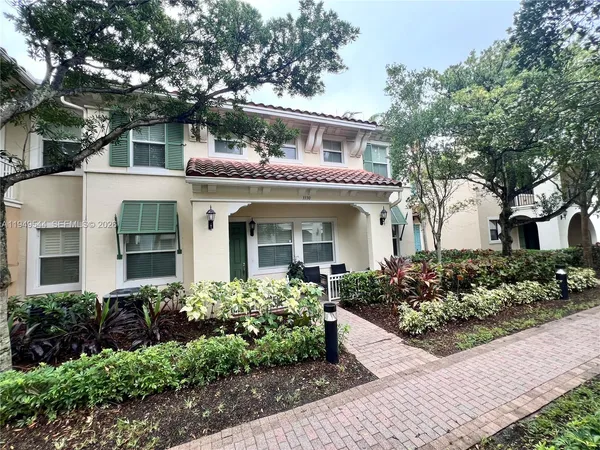 front view of a house with a small yard