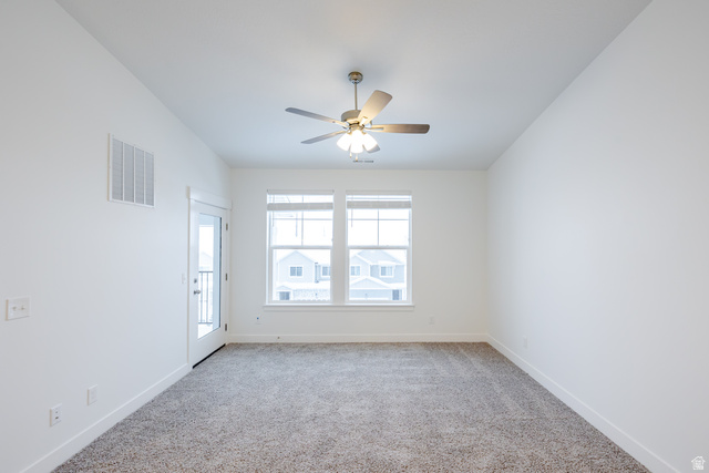 709 West 4500th South, Unit N302 Mapleton, UT 84664 - Photo 12 of 15 Empty room with light colored carpet and ceiling fan