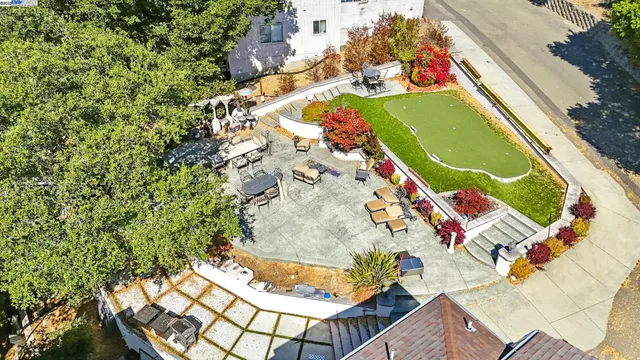 an aerial view of a house with a swimming pool