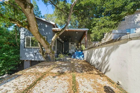 a view of a house with a small yard