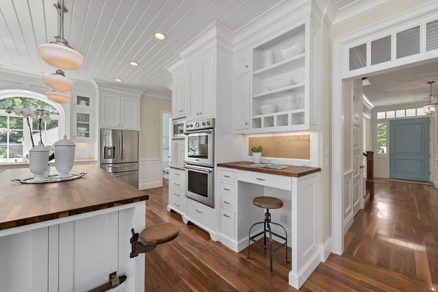 a kitchen with a sink cabinets and window