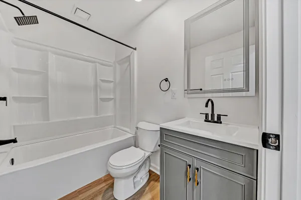 a bathroom with a sink a toilet and a bathtub