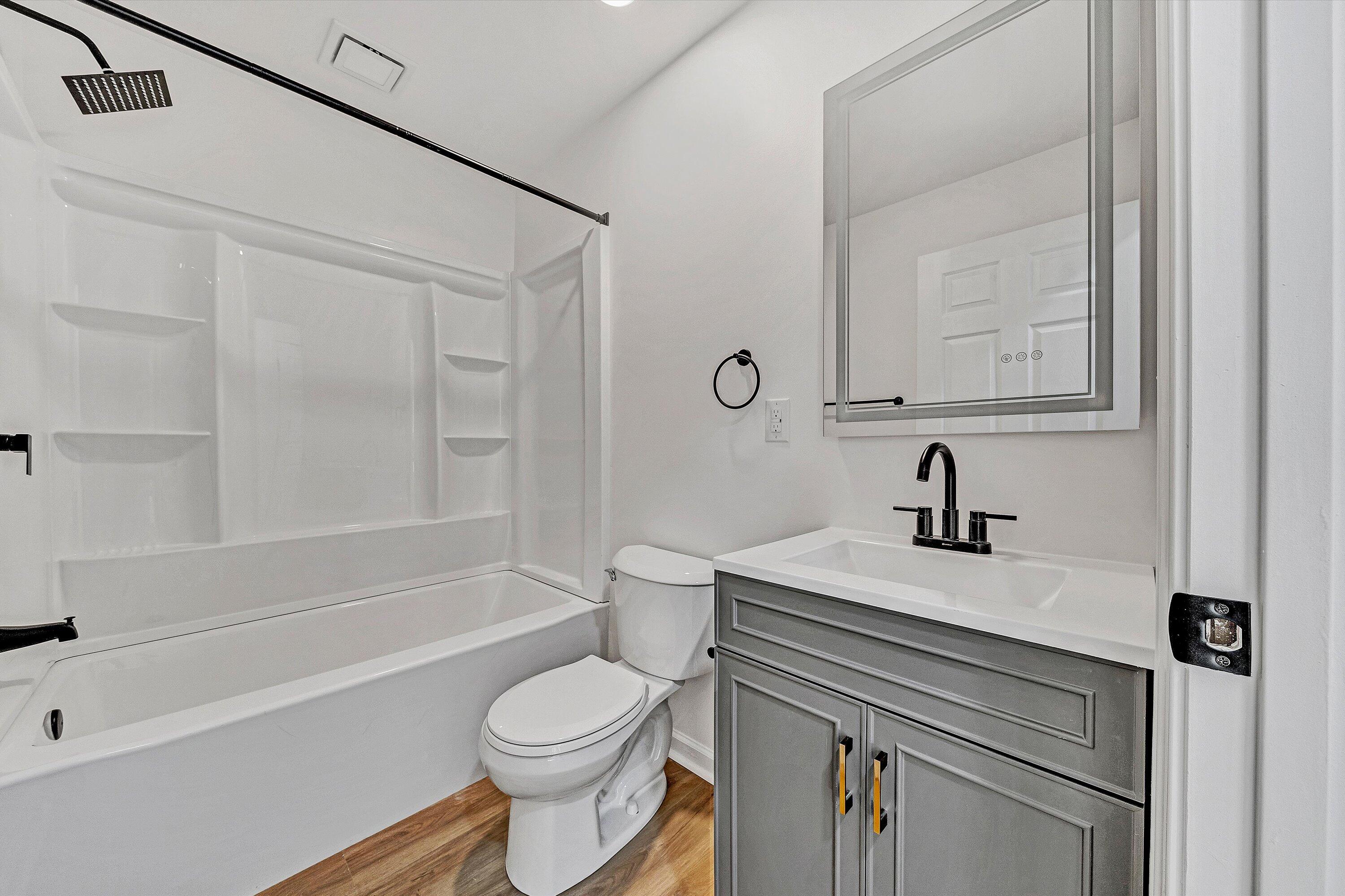 5962 2 Ford Road Roanoke, VA 24018 - Photo 12 of 39 a bathroom with a sink a toilet and a bathtub