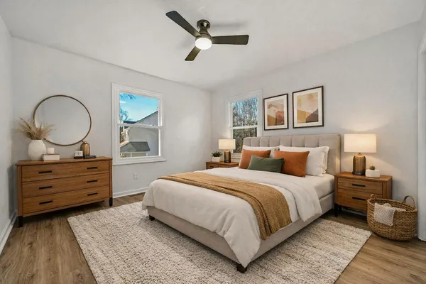 a bedroom with a bed and window