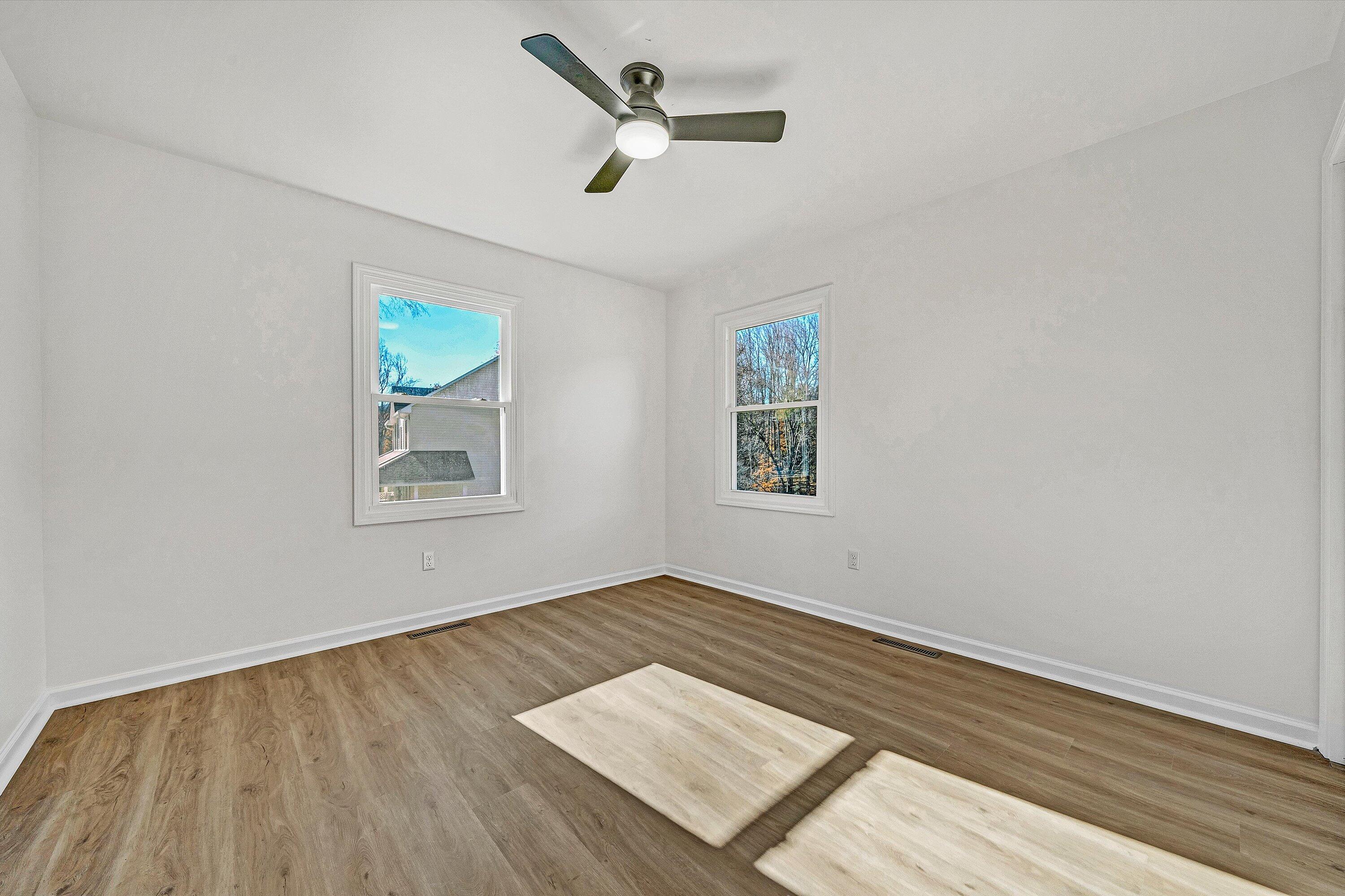 5962 2 Ford Road Roanoke, VA 24018 - Photo 14 of 39 wooden floor in an empty room with a window