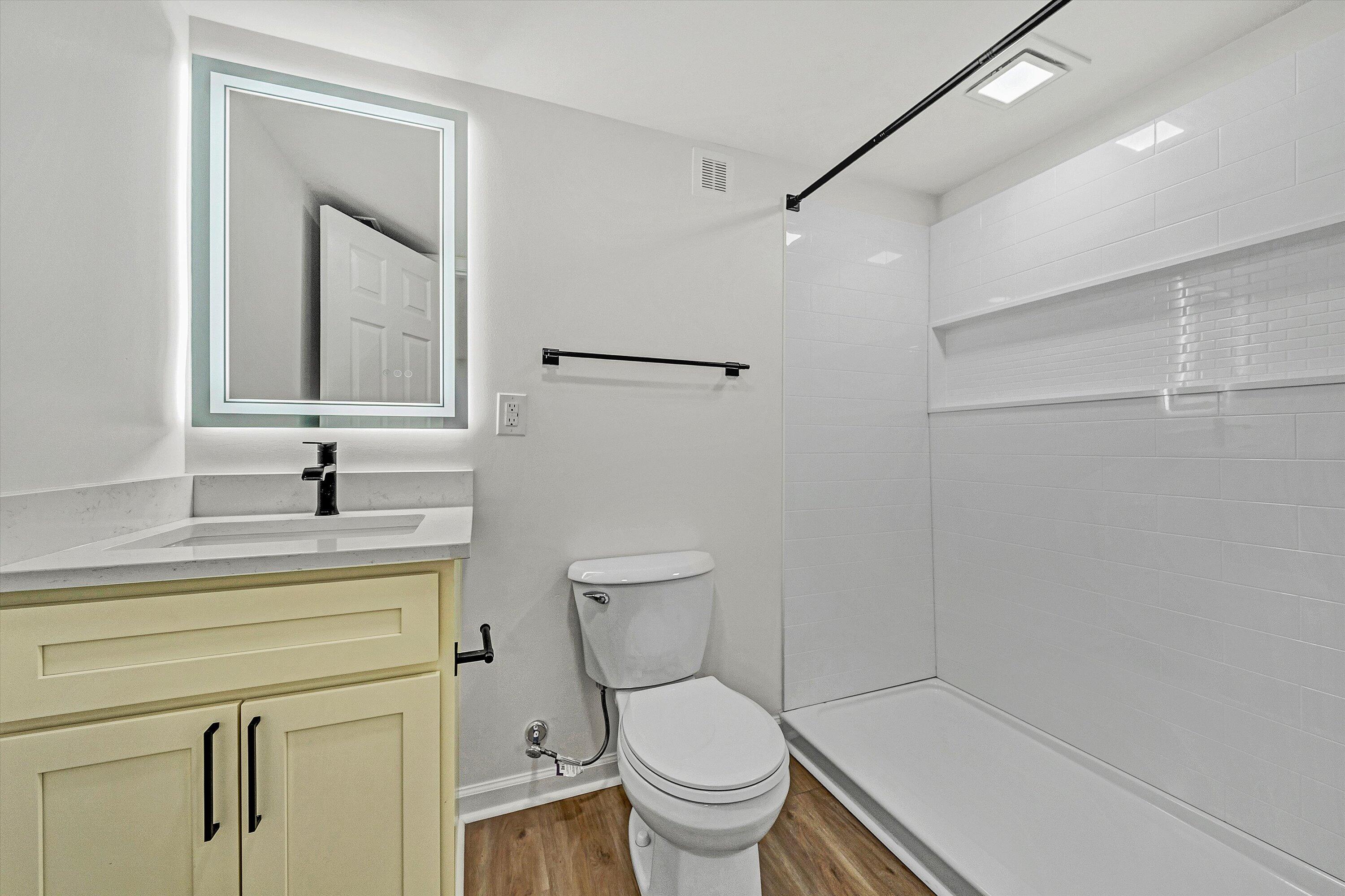 5962 2 Ford Road Roanoke, VA 24018 - Photo 22 of 39 a bathroom with a toilet a sink and a mirror