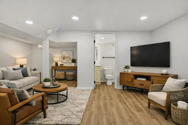 a living room with furniture and a flat screen tv