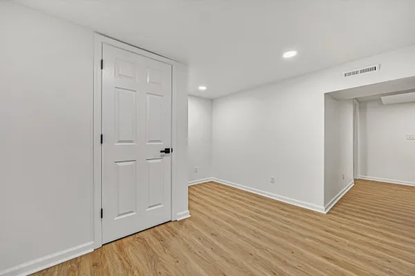 a view of room with wooden floor