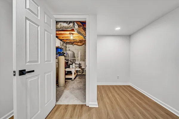a view of hallway with wooden floor