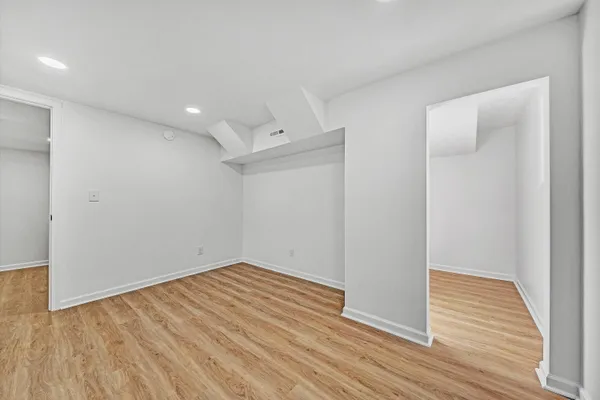 a view of room with wooden floor