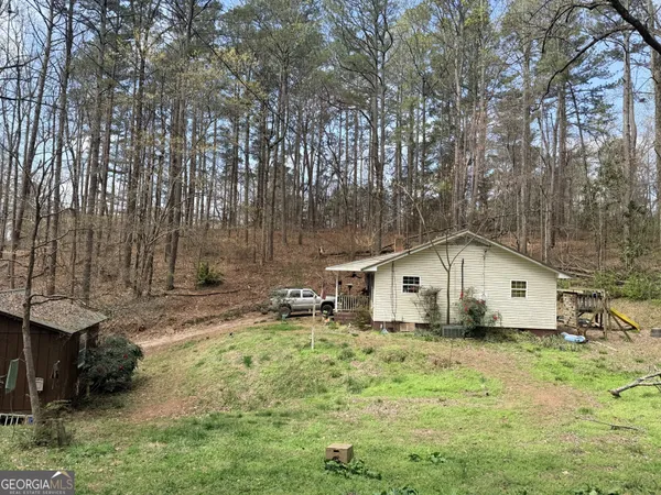 a house with trees in the background
