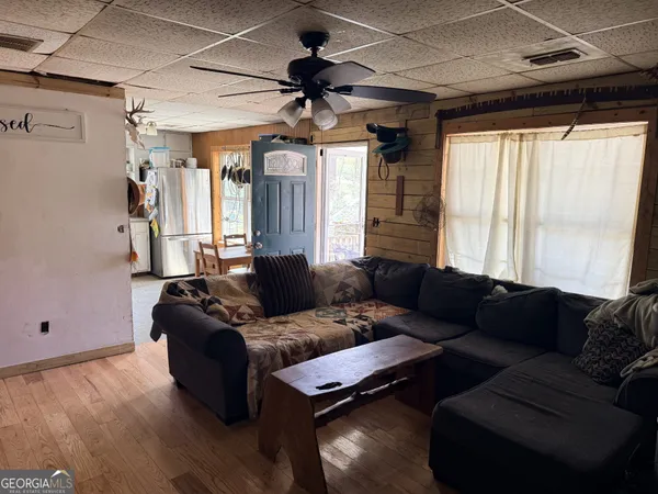 a living room with furniture and a window