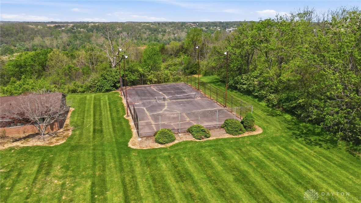 5669 O Neall Road Waynesville, OH 45068 - Photo 10 of 72 This property features a private tennis court nestled within a vibrant, lush green???????????????????????? landscape.