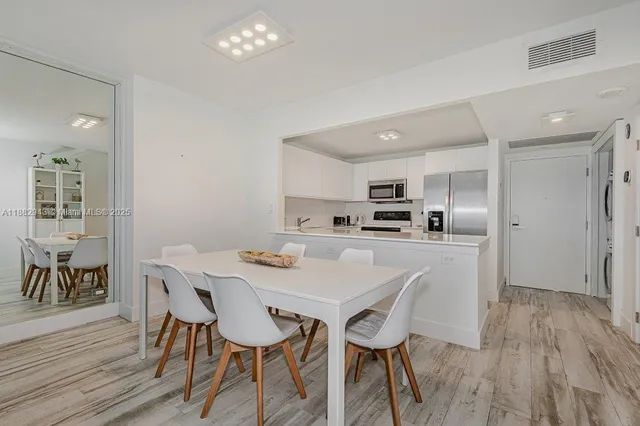 a kitchen with stainless steel appliances a refrigerator sink and stove