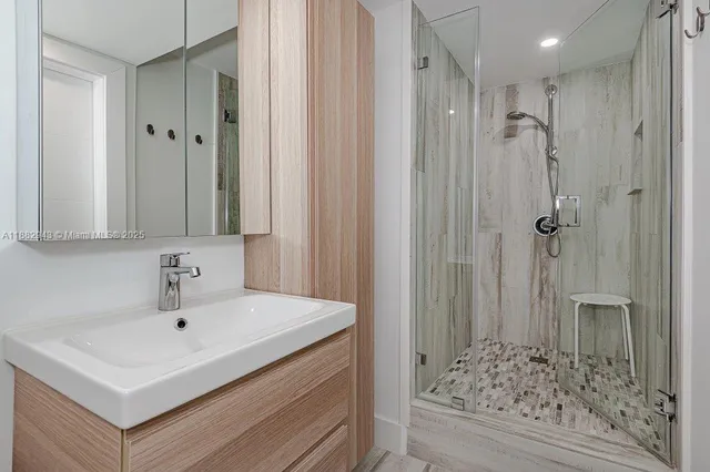 a bedroom with a bed and a mirror