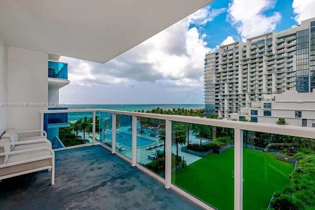 a view of a patio with couches and potted plants