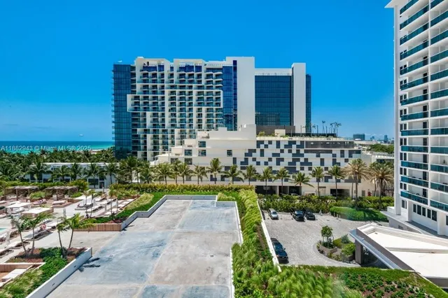 a kitchen with a sink window and cabinets