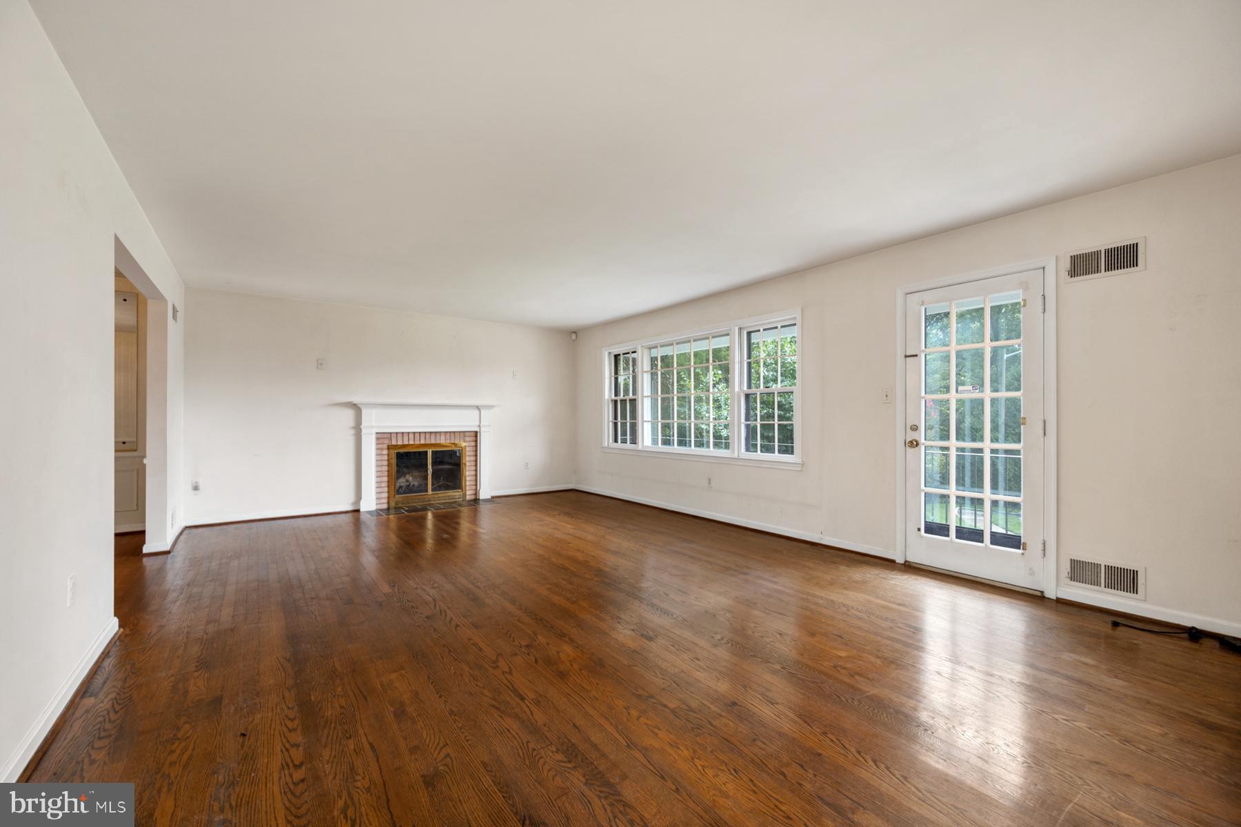 7320 Range Road Alexandria, VA 22306 - Photo 13 of 46 Large living room with wood-burning fireplace