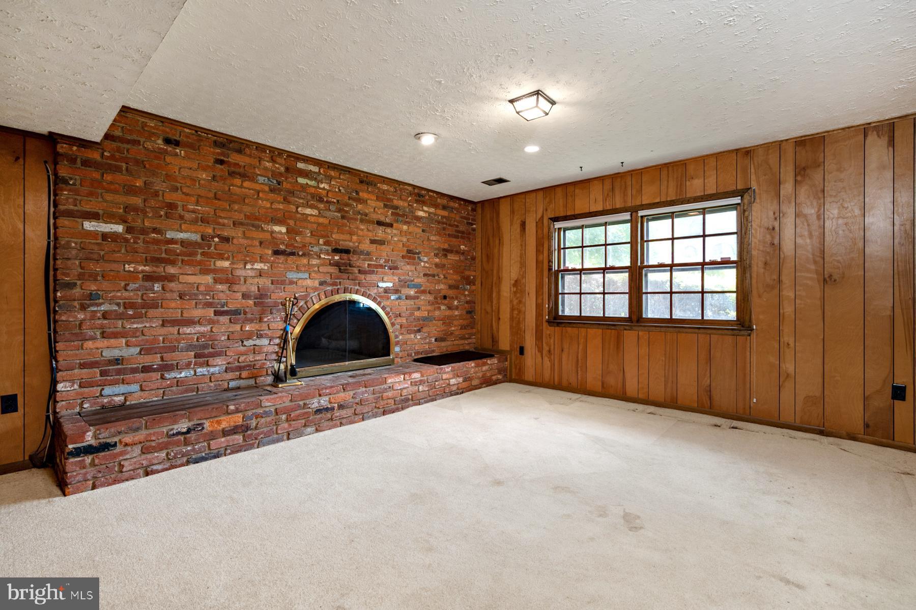 7320 Range Road Alexandria, VA 22306 - Photo 7 of 46 Recreation room with wood-burning fireplace