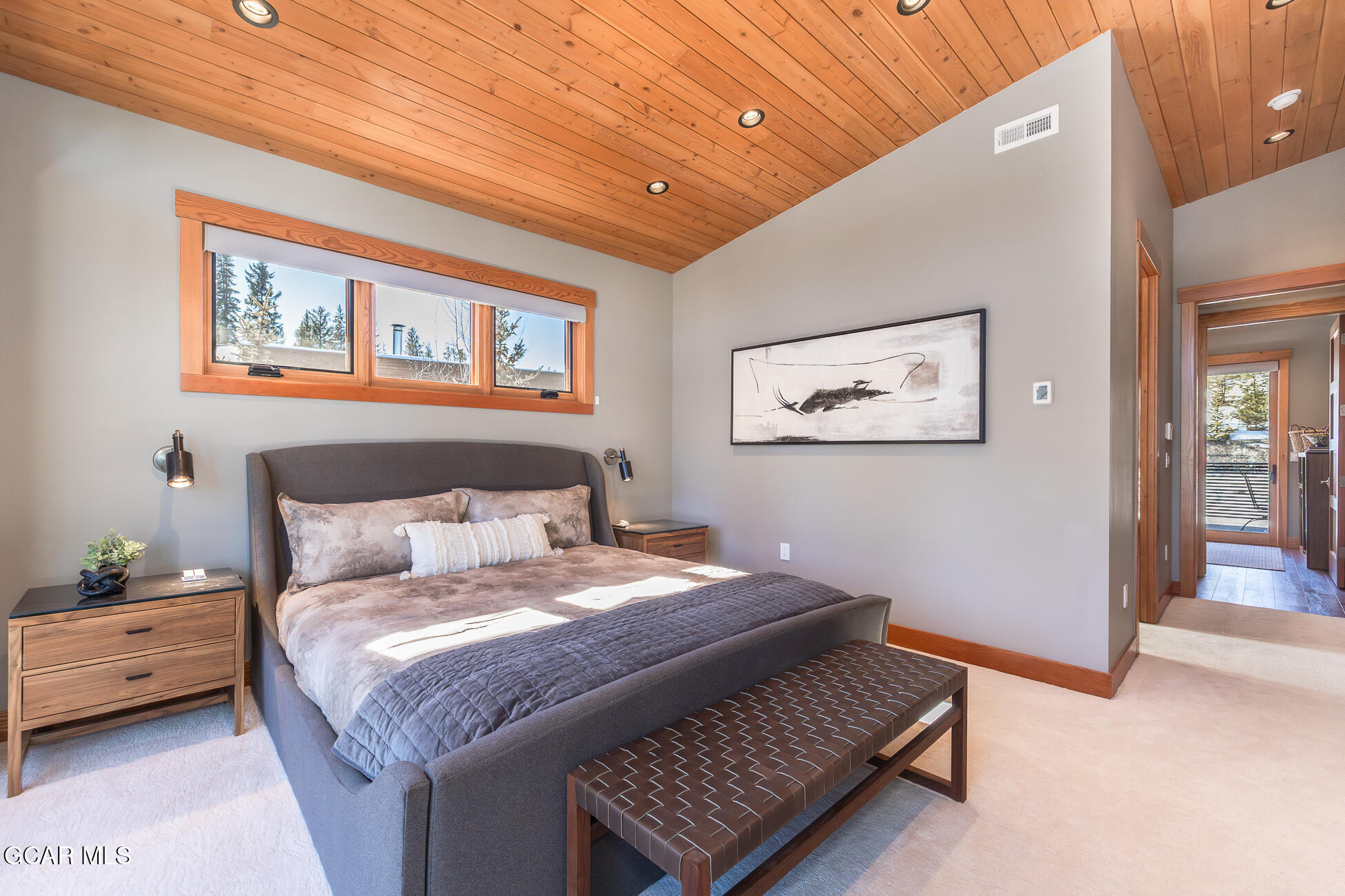 684 Vasquez Road Winter Park, CO 80482 - Photo 19 of 45 a bedroom with a bed and a painting on the wall