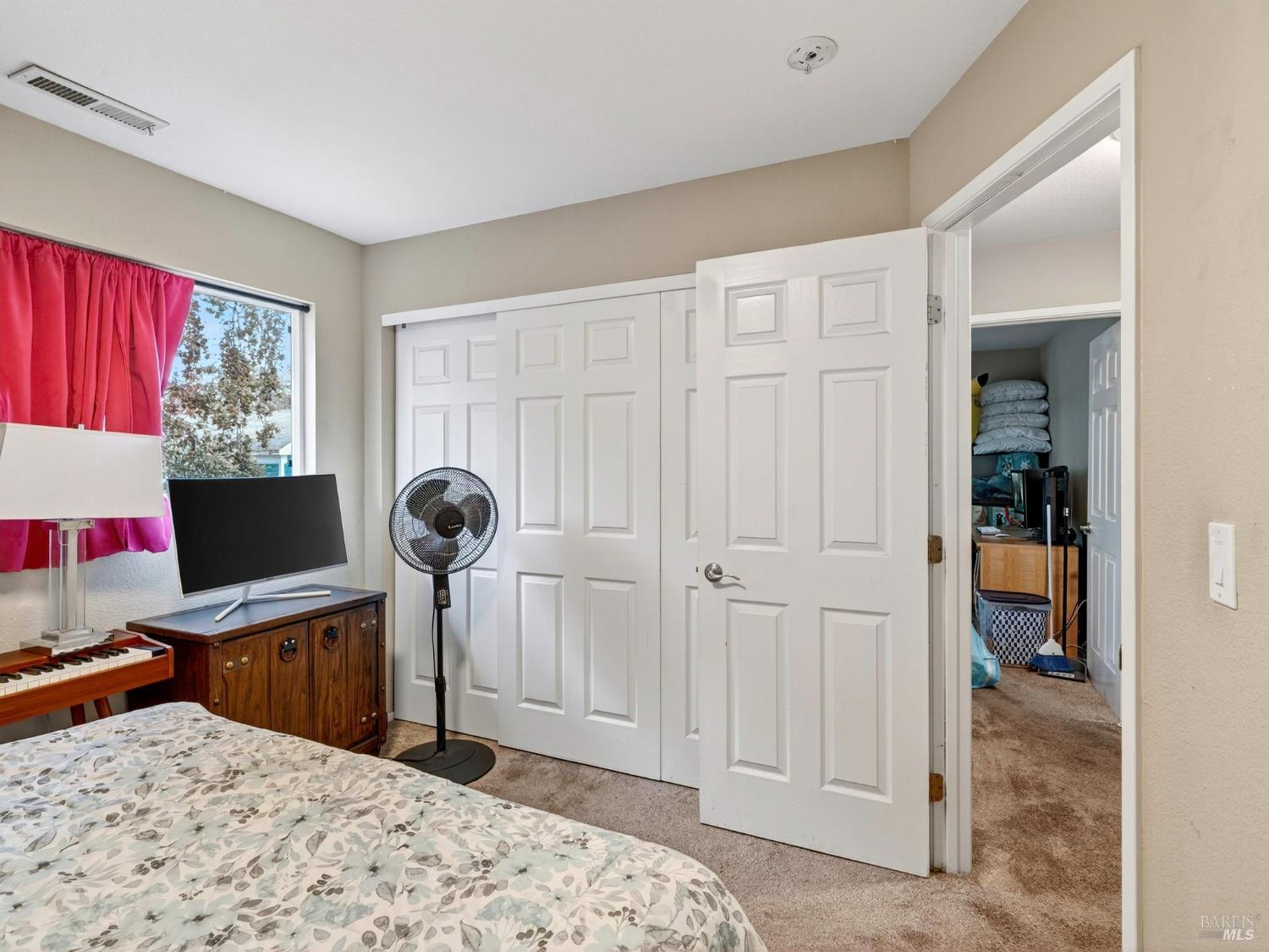 100-102 West 8th Street Santa Rosa, CA 95401 - Photo 13 of 32 a bedroom with a bed and a window