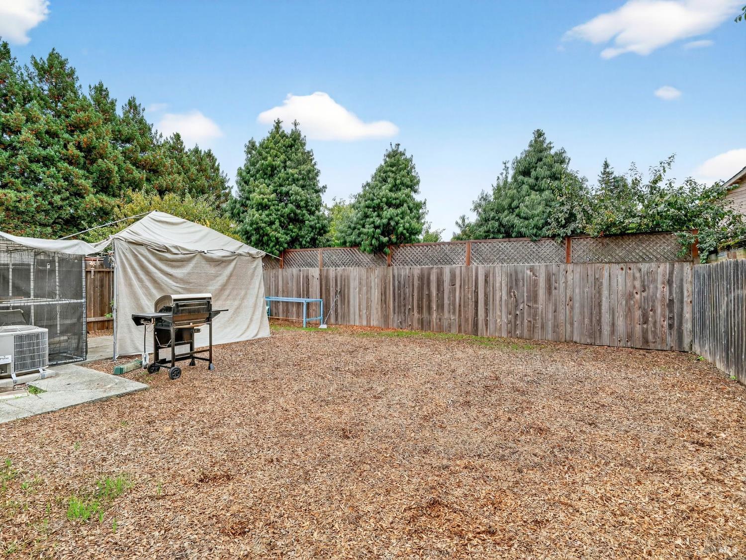 100-102 West 8th Street Santa Rosa, CA 95401 - Photo 16 of 32 a backyard of a house with table and chairs