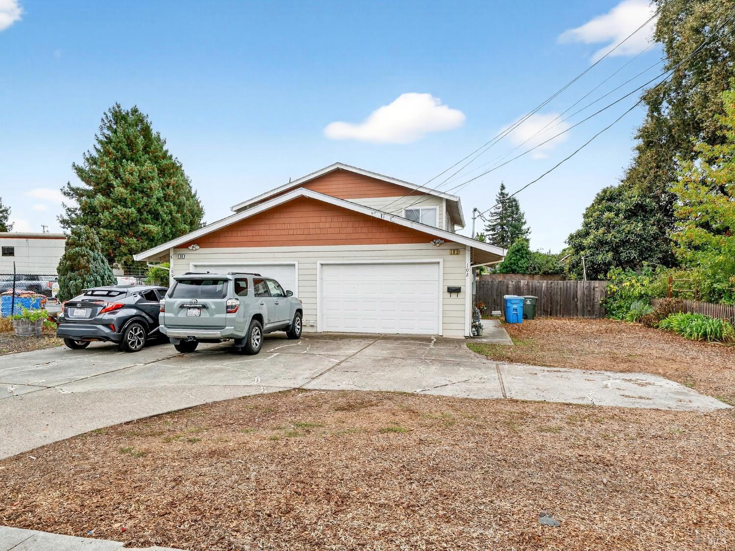 100-102 West 8th Street Santa Rosa, CA 95401 - Photo 2 of 32 a car parked in front of a house