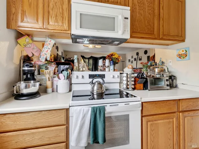 a kitchen with stainless steel appliances granite countertop a sink and cabinets