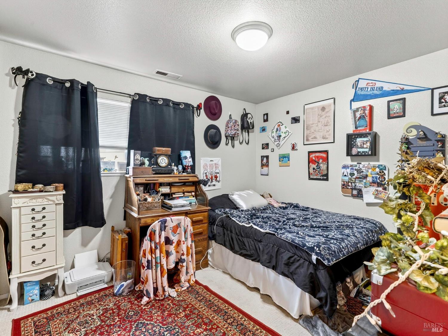 100-102 West 8th Street Santa Rosa, CA 95401 - Photo 24 of 32 a bed room with a bed and a couch