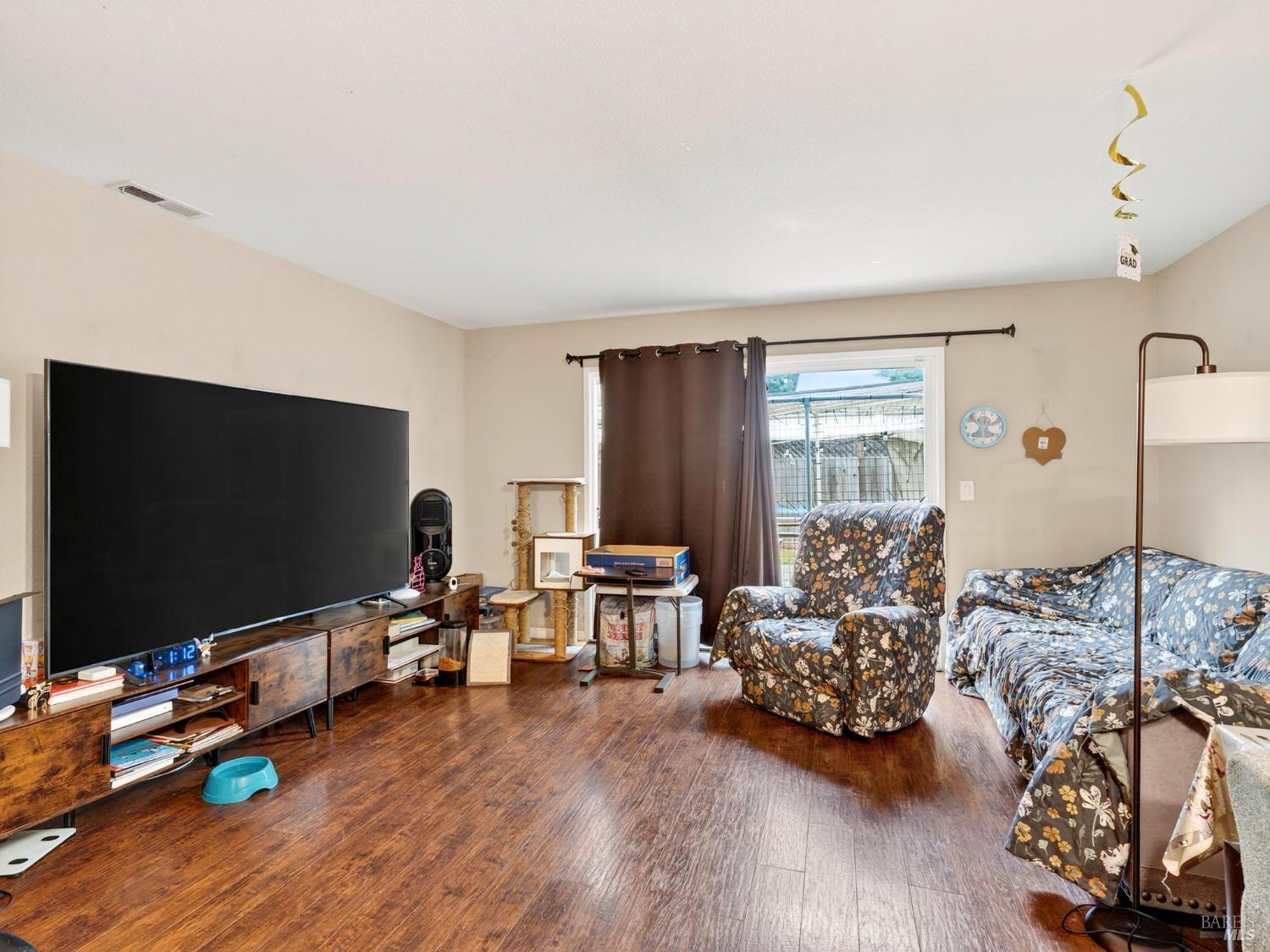 100-102 West 8th Street Santa Rosa, CA 95401 - Photo 5 of 32 a living room with furniture and a flat screen tv