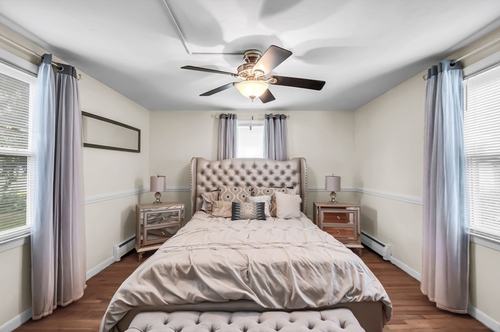 23 Gatewood Road Springfield, MA 01119 - Photo 14 of 31 a bedroom with a bed and a chandelier