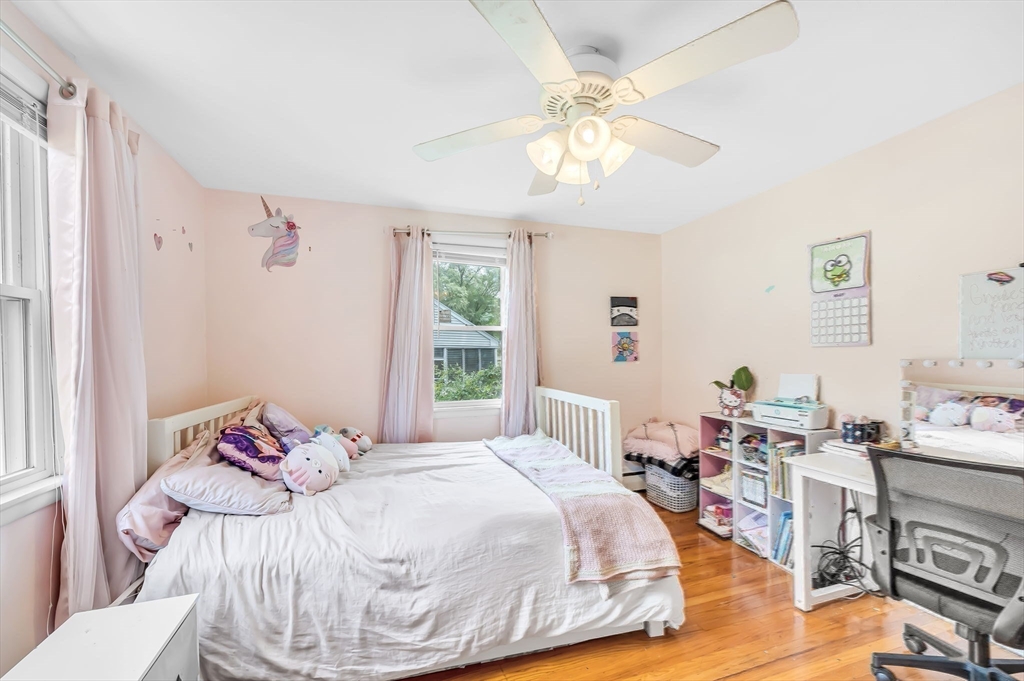 23 Gatewood Road Springfield, MA 01119 - Photo 17 of 31 a bedroom with a bed and a chandelier