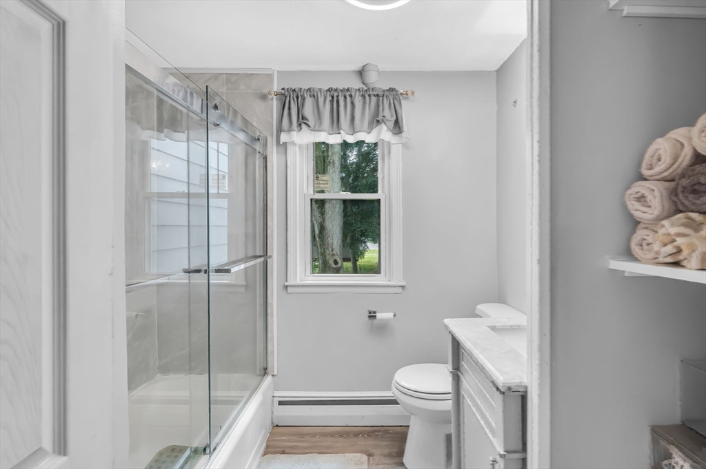 23 Gatewood Road Springfield, MA 01119 - Photo 20 of 31 a bathroom with a shower a toilet and a window