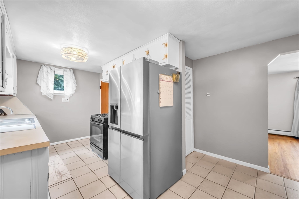 23 Gatewood Road Springfield, MA 01119 - Photo 4 of 31 a view of a refrigerator in kitchen and interior of the house