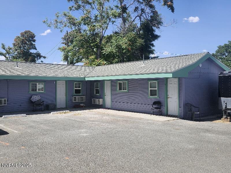 1145-1155 Cornell Avenue, Unit VARIOUS Lovelock, NV 89419 - Photo 3 of 7 a front view of a house with a yard