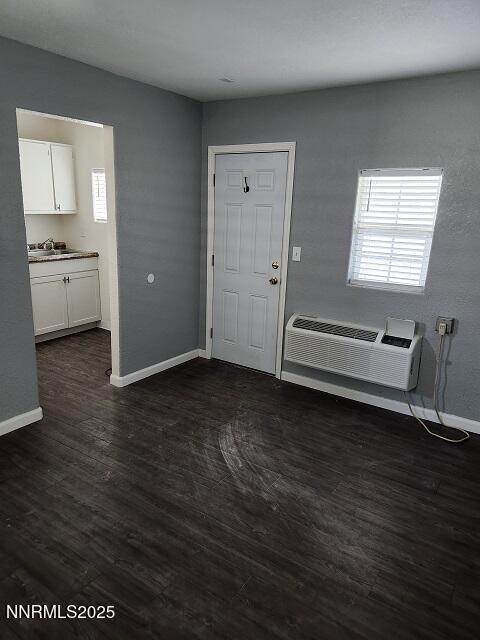 1145-1155 Cornell Avenue, Unit VARIOUS Lovelock, NV 89419 - Photo 4 of 7 a view of an empty room with wooden floor and a window