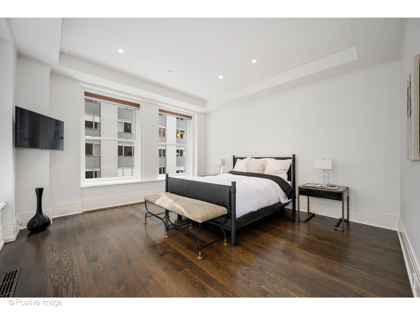 159 East Walton Place, Unit 7G Chicago, IL 60611 - Photo 21 of 37 a bed room with a bed tv and a window